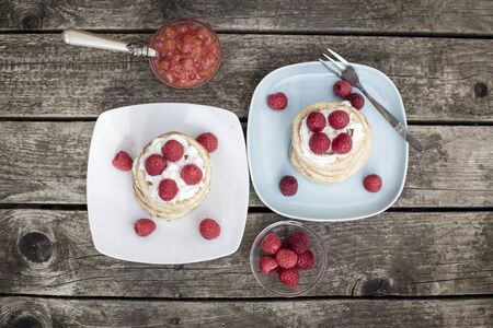 Pancakes with raspberries and cream, raspberry nectarine jamの写真素材
