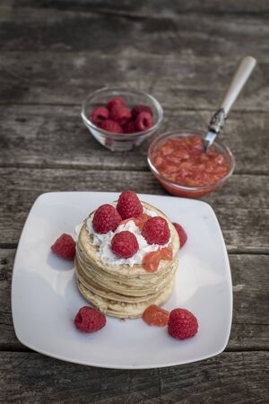 Pancakes with raspberries and cream, raspberry nectarine jamの写真素材