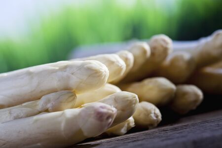 White asparagus on woodの写真素材