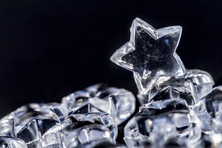 Glass stars in front of black backgroundの写真素材