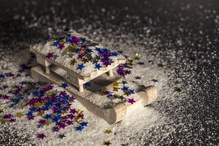 Sledge, powdered with colorful stars