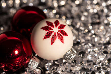 Christmas baubles on silver starsの写真素材