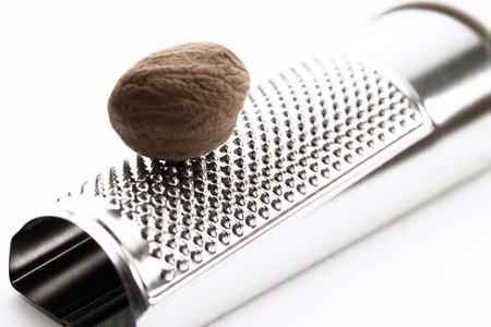 Nutmeg on graterの写真素材