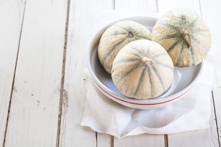 Charentais Melons in bowl, copy space