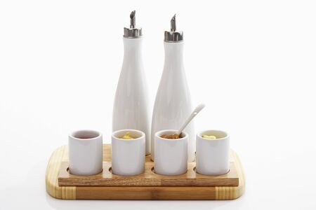 vinegar and oil stand and bowls with different dipsの写真素材