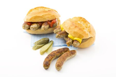 Nuremberg grilled sausages, roll and mustard, ketchup and gherkinの写真素材