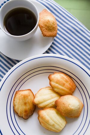 Home made Madeleine cookies, coffee cupの写真素材