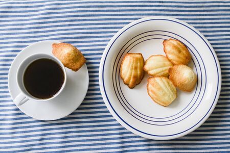 Home made Madeleine cookies, coffee cupの写真素材