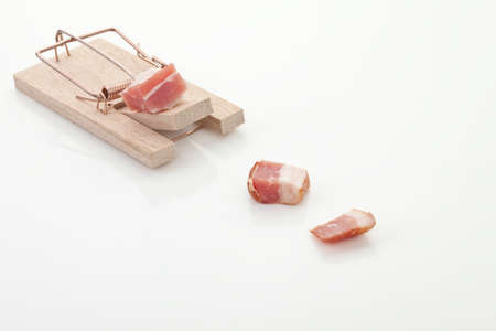 Mousetrap with ham on white backgroundの写真素材