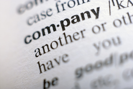 Extreme close up of english dictionary page with word companyの写真素材