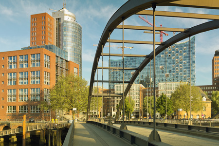 view on the Niederbaumbridge and Kehrwiederspitze, HTC and landmark Elbphilharmonie in Hamburg, Germanyの写真素材