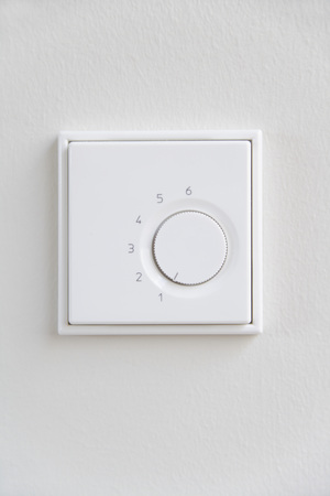 Germany,Upper Bavaria,Munich,Close up of dimmer switch against white wall