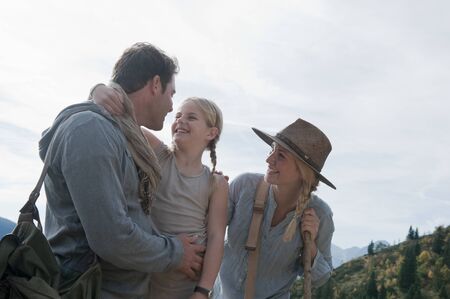 Austria,Salzburg Country,Filzmoos,Family hiking on alpine pastureの写真素材