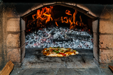 Pizza oven, vegetarian pizzaの写真素材