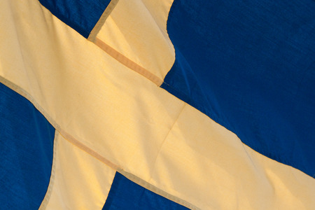Closeup of blue and yellow Sweden flagの写真素材