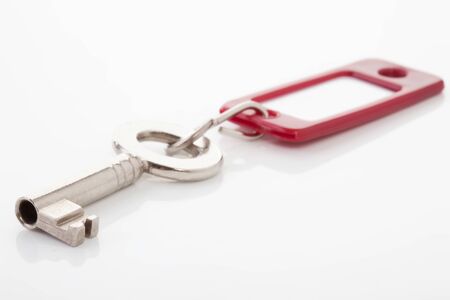 Key with key ring on white backgroundの写真素材