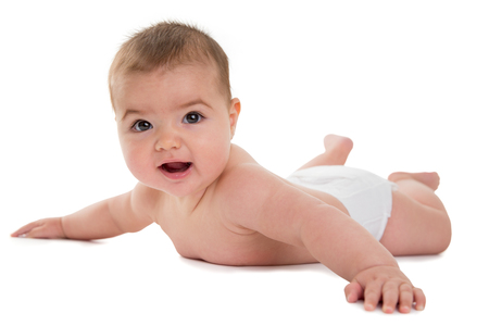 Female baby lying on white backgroundの写真素材