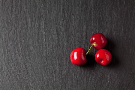 Sweet cherries on slateの写真素材