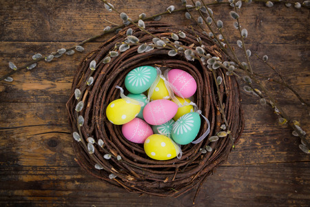 Easter decoration, Easter eggs, twigs on wood