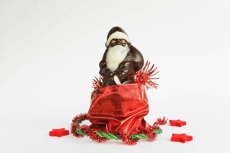 Santa Claus, chocolate, in red bagの写真素材