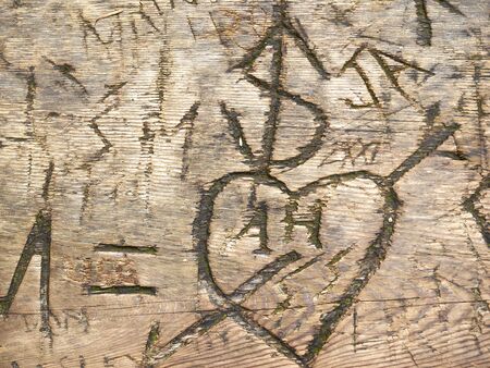 Wood structure, carved letters, heartの写真素材