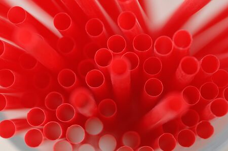 Bunch of red drinking straws, close up.の写真素材