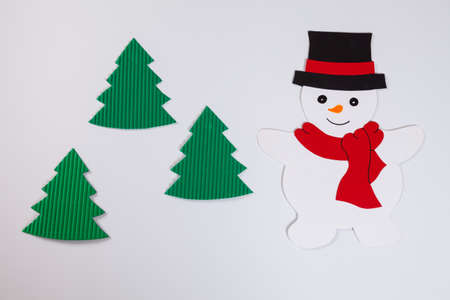 Snowman and fir trees, white background