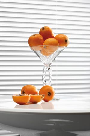 Ripe Medlars  (Mespilus germanica) in cocktail glassの写真素材
