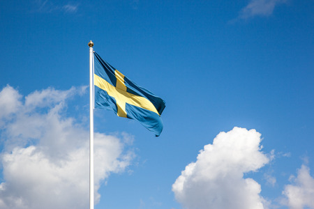 Flag of Sweden, cloudy skyの写真素材