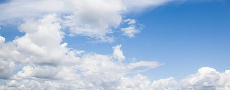 Different types of clouds on blue sky, sea gulls flying