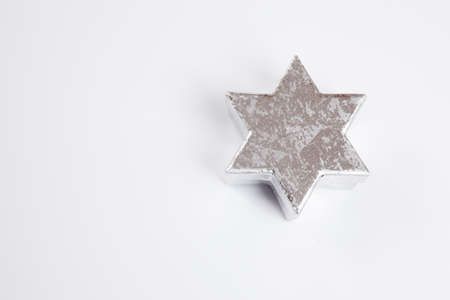 Silver star, white background, copy spaceの写真素材