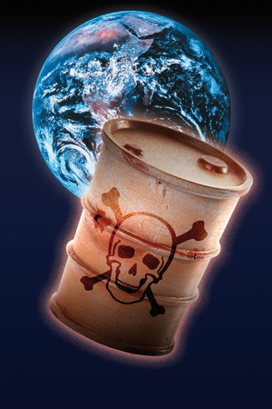 Barrel with signs of skull and crossbones in front of earthの写真素材