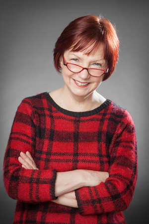 Red-haired woman, Portrait, Facial expression, smiling, arms crossedの写真素材