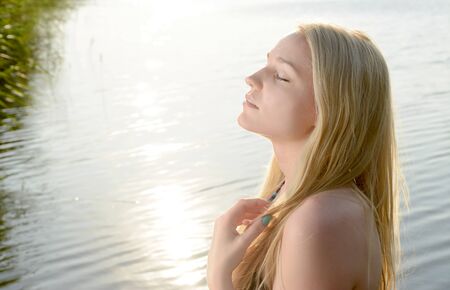 Beautiful blonde young woman, portraitの写真素材