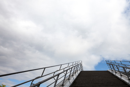 Stairs under cloudy skyの写真素材