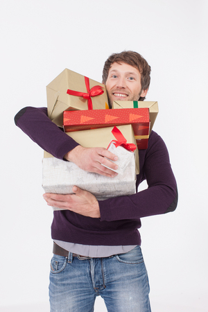 adult man with Christmas gifts, smiling, portraitの写真素材