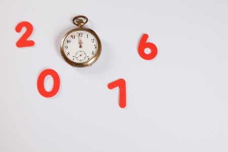 Year 2016, pocket watch, 12 o'clock, white background, copy space