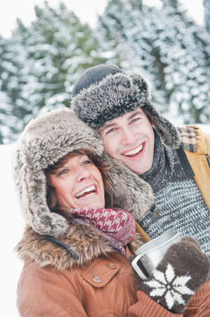 Austria,Salzburg Country,Flachau,Close up of young man and woman in winterの写真素材