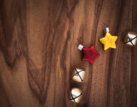 Christmas decoration, stars and bells on woodの写真素材