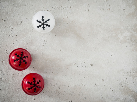 Christmas decoration, bells, red, white, background concreteの写真素材