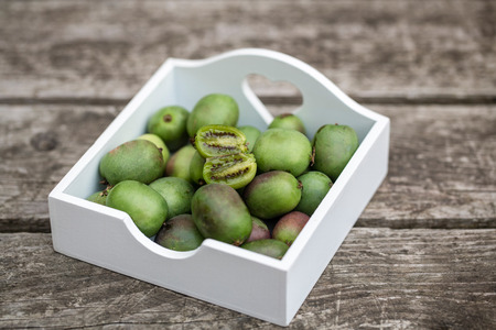 Kiwi berries in wooden boxの写真素材