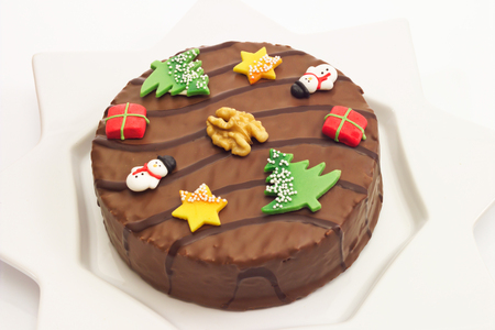 Walnut cake with chocolate coating and marzipan decoの写真素材