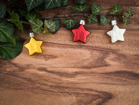 Christmas, ivy, christmas decorations, stars on wood, copy spaceの写真素材