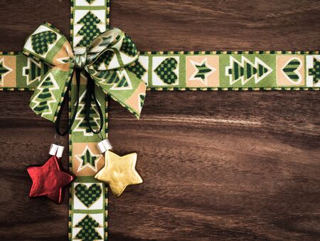 Christmas, gift ribbon on wood, christmas decoration, starsの写真素材