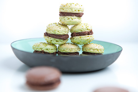 Home-made pistachio macaroons on plateの写真素材