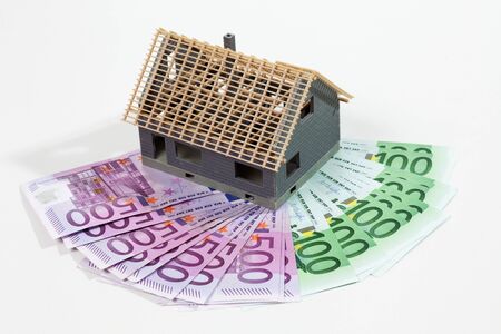 Model house on fanned euro notesの写真素材