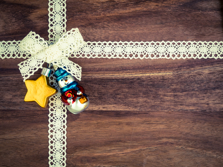 Christmas, lace, present, christmas decoration star and snowman on woodの写真素材