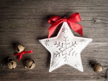 Christmas decoration, star and bells on woodの写真素材