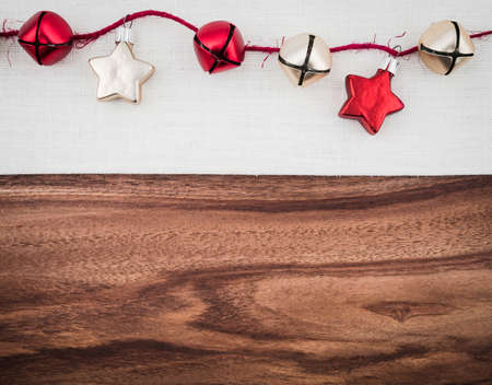 Stars and bells, christmas decoration on linen, wood, copy spaceの写真素材