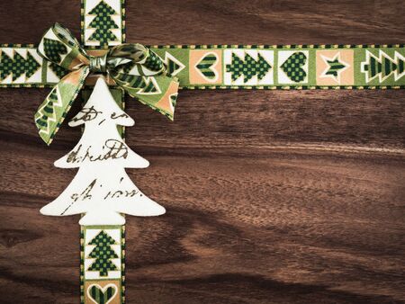 Christmas, gift ribbon on wood, christmas decoration, tree of feltの写真素材